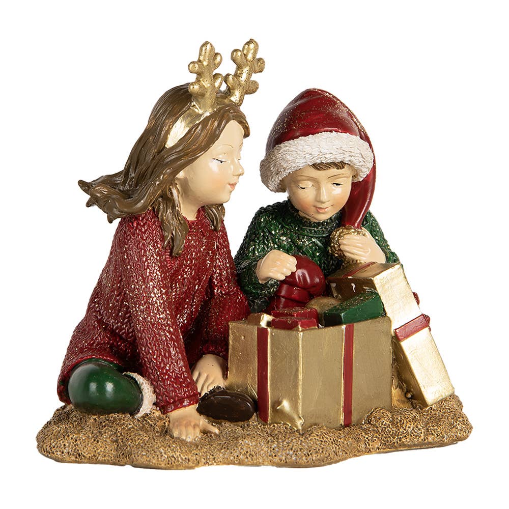 Weihnachtsfigur – Kinder beim Geschenk auspacken